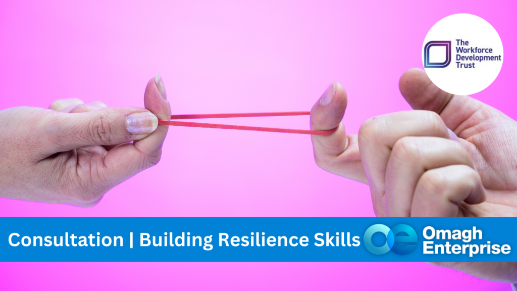 Pink background.. Two fingers from different hands shown. A rub band stretched between the two, creating tension. Blue banner along bottom, with white text. "Consultation | Building Resilience Skills" Omagh Enterprise logo within the banner.