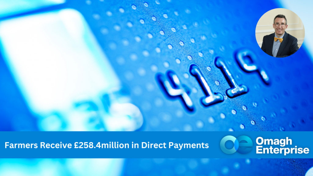 Close up of a blue credit card. Number 411 are visible. Blue banner along the bottom, with white text. "Farmers Receive £258.4million in Direct Payments" Omagh Enterprise logo within the banner.