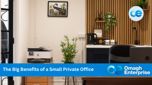 Small private office with a printer, a plant, a coffee maker, and desk decor. Wood paneling and wall art enhance the space. Blue banner reads: "The Big Benefits of a Small Private Office.