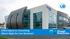 Modern building with Omagh Enterprise logo. Text reads: "Office Space vs. Coworking: What's Right for Your Business?.
