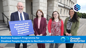Four people stand outside a building, one holding a sign that reads "All Island Self Employment for Persons with Disabilities Programme." Omagh Enterprise and programme details are shown below.