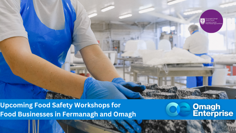 Two workers in blue aprons handle food in a clean facility. Text overlay promotes food safety workshops for businesses in Fermanagh and Omagh.