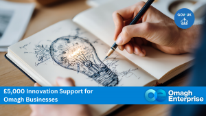 A hand sketches a lightbulb filled with creative designs in an open notebook. Blue banners read £5,000 Innovation Support for Omagh Businesses and Omagh Enterprise, with a GOV.UK logo in the top right corner.