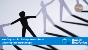 Paper cutout figures holding hands, symbolizing unity. Banner text reads, "New Support for Entrepreneurs from Underrepresented Groups - Omagh Enterprise.