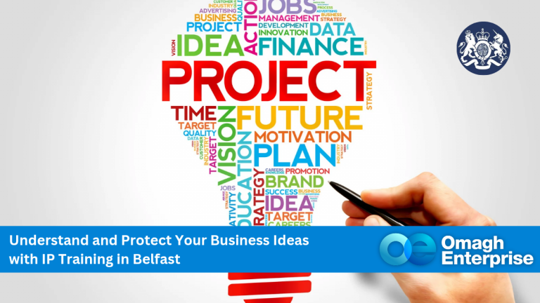 A hand drawing a lightbulb filled with colorful business-related words like "PROJECT," "IDEA," and "FUTURE," with a banner promoting IP training in Belfast by Omagh Enterprise.
