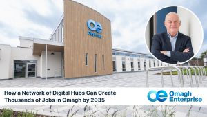 A modern building labeled "Digital Hub" with a circular inset of a man in a suit. Text reads: "How a Network of Digital Hubs Can Create Thousands of Jobs in Omagh by 2035.