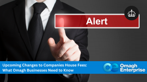 A person in a suit points at a virtual red "Alert" button; a banner below reads, "Upcoming Changes to Companies House Fees: What Omagh Businesses Need to Know.