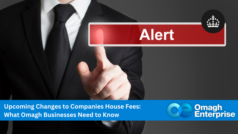 A person in a suit points at a virtual red "Alert" button; a banner below reads, "Upcoming Changes to Companies House Fees: What Omagh Businesses Need to Know.