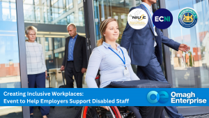 A woman in a wheelchair exits a building with colleagues. Event banner promotes support for disabled staff at Omagh Enterprise, featuring partner logos.