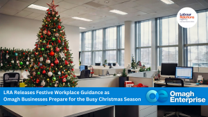 Modern office decorated for Christmas with a large tree and festive ornaments; a news banner discusses workplace guidance for the holiday season.