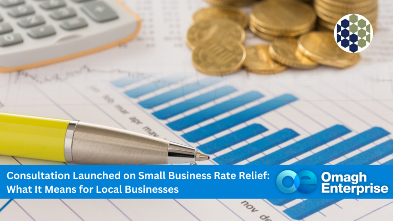 A pen, calculator, and stacks of coins rest on financial charts, with a banner about a consultation on small business rate relief by Omagh Enterprise.