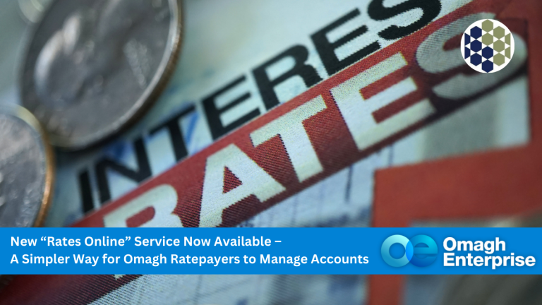 Close-up image of the word RATES in bold red letters with coins in the background. A blue banner at the bottom displays text about a new Rates Online service by Omagh Enterprise for managing accounts.