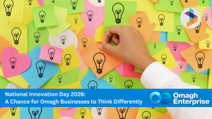 A hand places a sticky note with a lightbulb icon among many colorful sticky notes on a wall. Banner text promotes National Innovation Day 2026 for Omagh businesses.