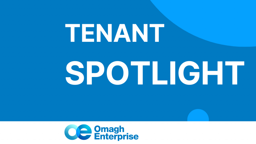 A graphic with the text "TENANT SPOTLIGHT" in bold white letters on a blue background, with the Omagh Enterprise logo and name at the bottom.