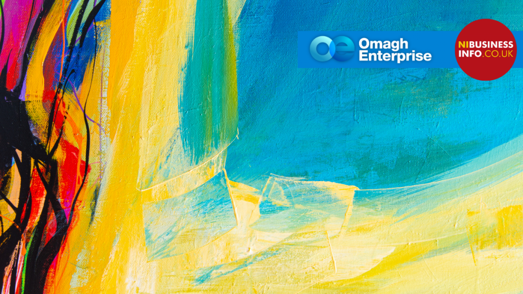 Abstract painting with bold yellow, blue, and orange, featuring Omagh Enterprise and NI Business Info logos in the top right corner.