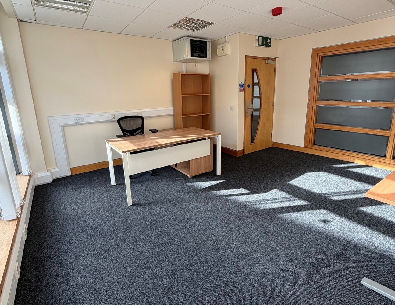 Private office to rent with desk, office chair and bookcase at Omagh Enterprise, Great Northern Road, Omagh