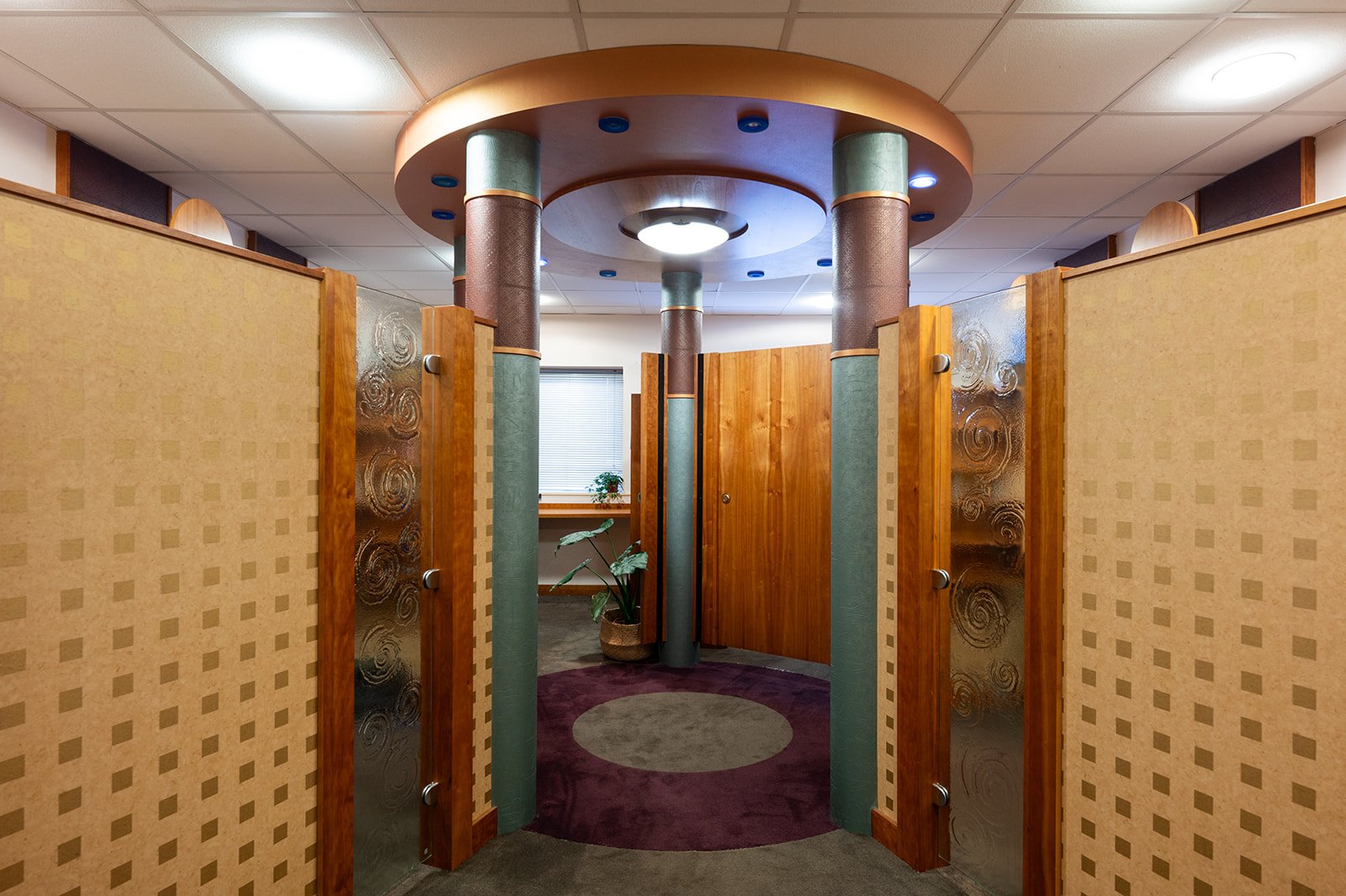 Circular private cubicle desk area with wooden doors at Omagh Enterprise, Great Northern Road, Omagh